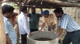 Inspecting vermin pits by Mennonite Central Committee officers